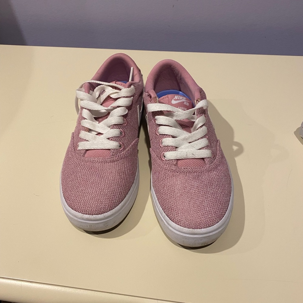 Women’s pink Nike sneakers